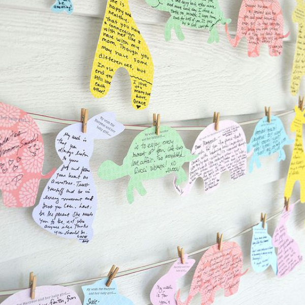 Animal-shaped pieces of paper on a clothesline with advice written on each piece of paper.