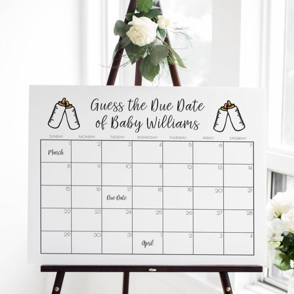 A calendar on an easel. The calendar says "Guess the Due Date of Baby Williams."