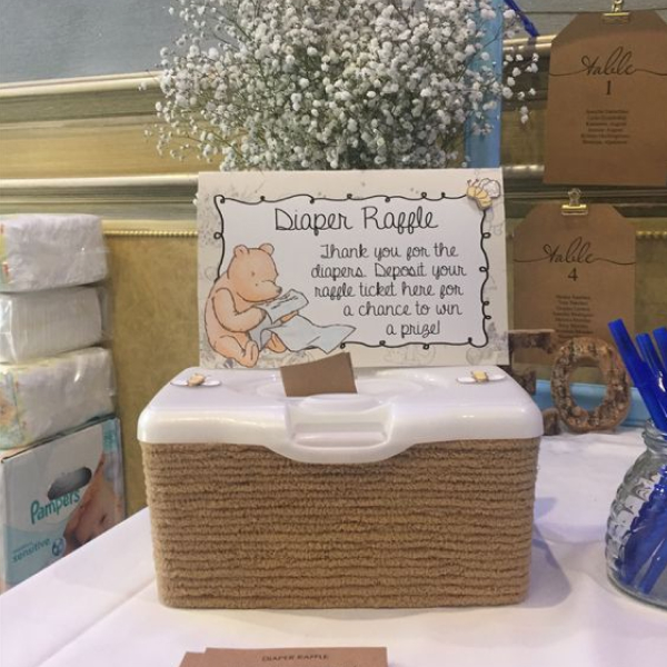 A box with a sign that says "Diaper Raffle."