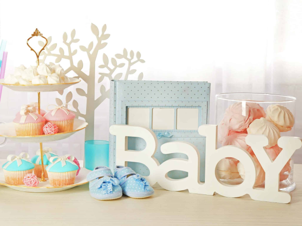 A dessert table with a sign that says "Baby."