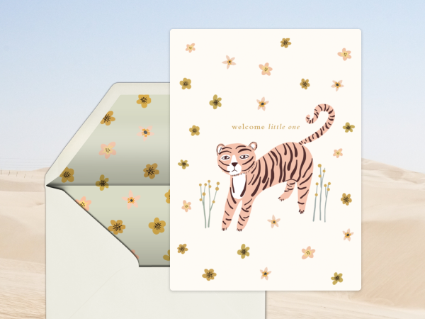 A baby shower card with a cute tiger on it. 