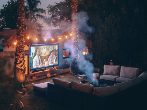 A backyard set up with a projector for a movie night.